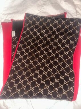 Authentic Gucci GG Logo Monogram Scarf with Red Trim. Excellent condition.